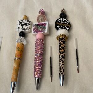 3 bling beaded pens,‎ new. Come in a bag and refill.